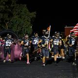 Apache Junction High School Photo #6 - Football players running out onto their field.